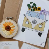 Close up of the sunflower embroidery hoop and camper van print