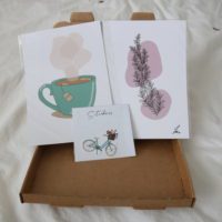 Overview of the letterbox mystery featuring 2 prints and a sticker