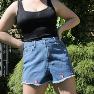 Hand embroidered blue denim shorts with red toadstool mushrooms