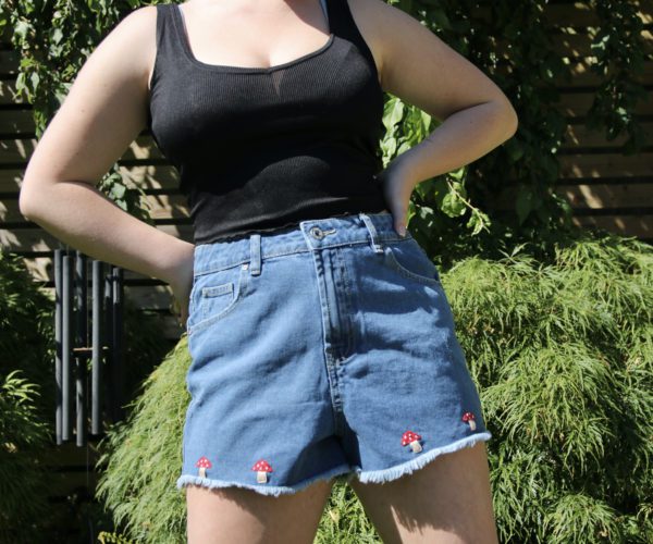 Hand embroidered blue denim shorts with red toadstool mushrooms