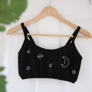 black bralette with hand embroidered white moon, stars and planet