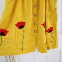 Hand embroidered red poppies