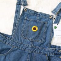 Close up of the pocket with an embroidered sunflower