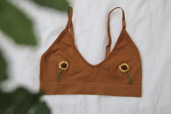 light brown bralette with 2 hand embroidered sunflowers