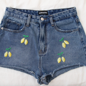 Blue denim shorts hand embroidered with lemons