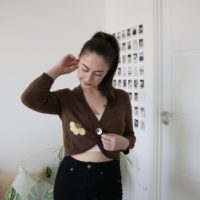 brunette model wearing brown knitted cardigan