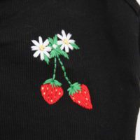 close up of hand embroidered strawberries