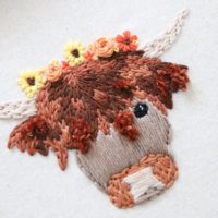 Close up of the embroidery stitch work on Elsie the highland cow