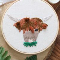 close up of the hand embroidered highland cow