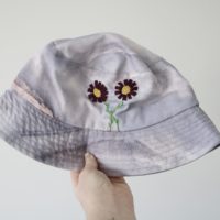 purple marble bucket hat with hand embroidered dark purple cosmos flowers