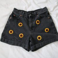 black denim shorts hand embroidered with 6 yellow sunflowers