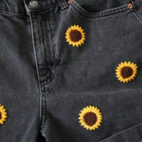 close up of the right side of the embroidered sunflower shorts