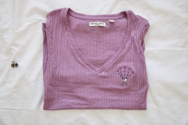 purple top with a v-neck, hand embroidered with a bouquet of lavender