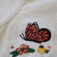 Close up of the stitch work on the orange monarch butterfly