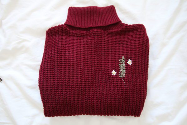Dark red jumper hand embroidered with rosemary and daisies
