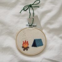 hand embroidered 3 inch decoration with a blue tent and campfire