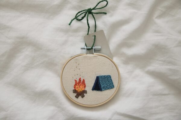 hand embroidered 3 inch decoration with a blue tent and campfire