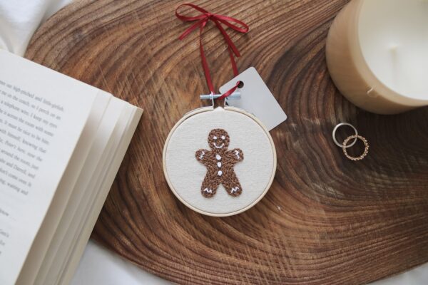 3 inch Christmas tree decoration. hand embroidered with a gingerbread man