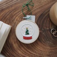 Christmas tree decoration hand embroidered with a snow globe and Christmas tree