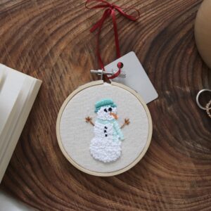 Christmas tree decoration hand embroidered with a snowman wearing a hat and scarf