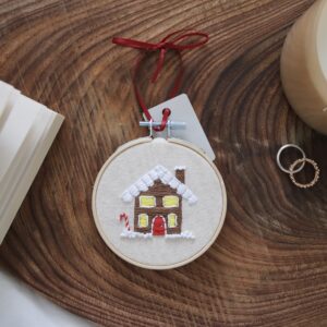 christmas tree decoration hand embroidered with a gingerbread house