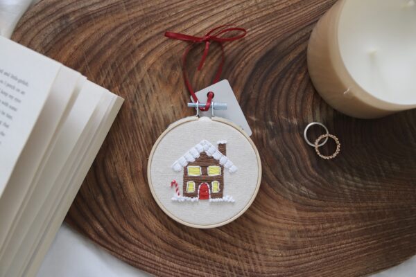 christmas tree decoration hand embroidered with a gingerbread house