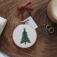 Christmas tree decoration hand embroidered with a Christmas tree and gold star