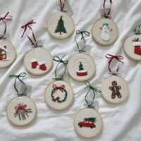 Overview of 10 hand embroidered Christmas tree decorations