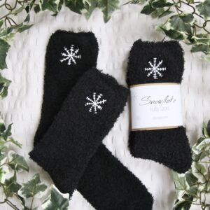 black fluffy socks hand embroidered with white snowflakes
