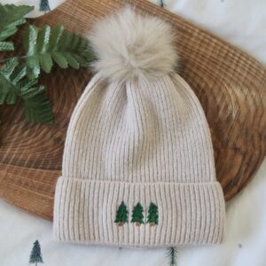 Cream beanie hand embroidered with 3 evergreen trees