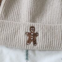 Close up of a hand embroidered gingerbread man