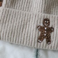 Close up of a hand embroidered gingerbread man