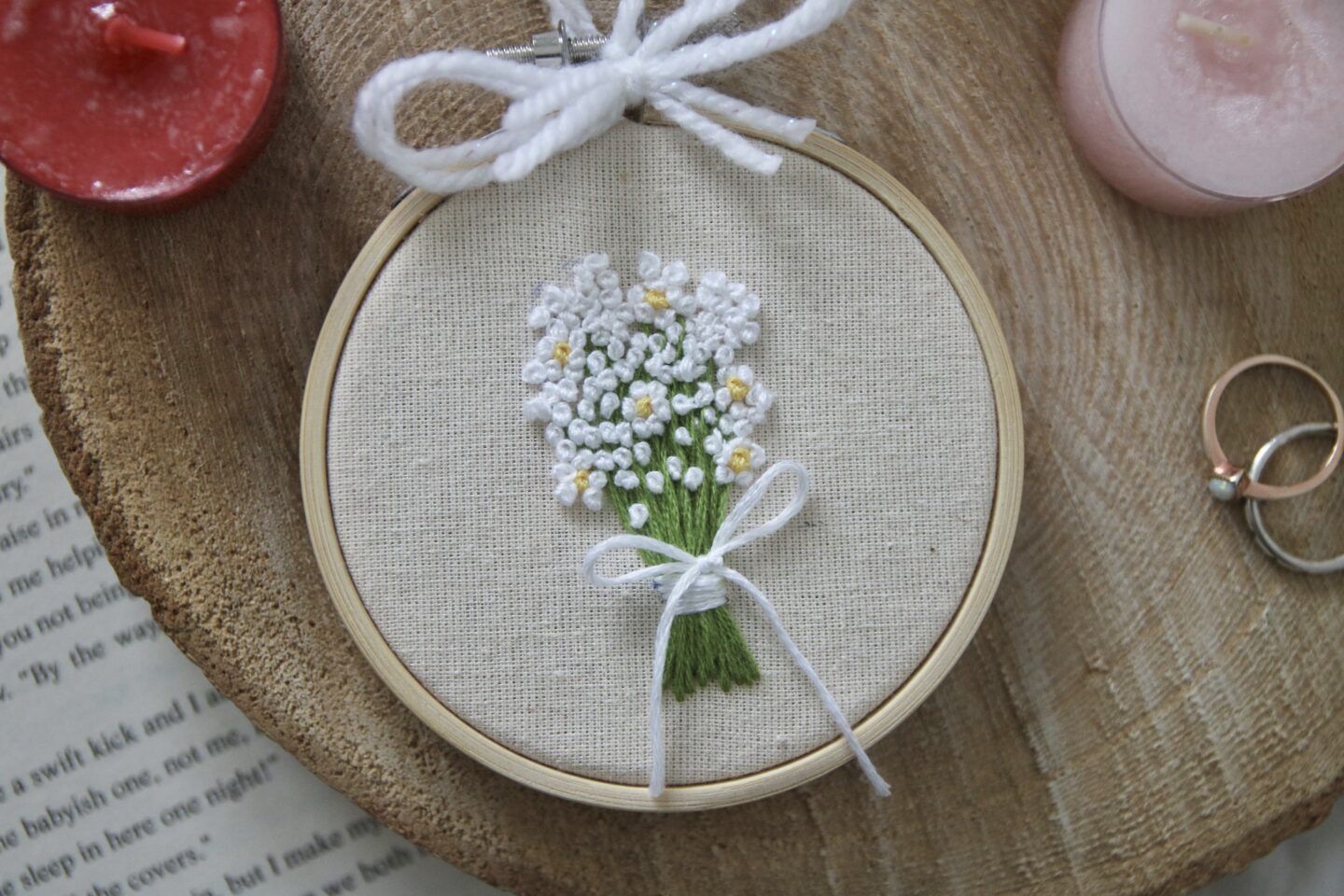 A hand embroidered bouquet of flowers of baby's breath