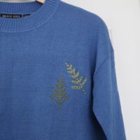 Blue jumper hand embroidered with 2 green fern leaves