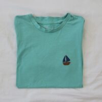 Turquoise blue tee embroidered with a boat