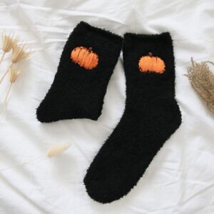 Black fluffy socks with hand embroidered orange pumpkins