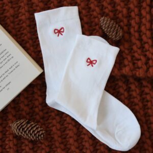 White cotton socks hand embroidered with a red bow