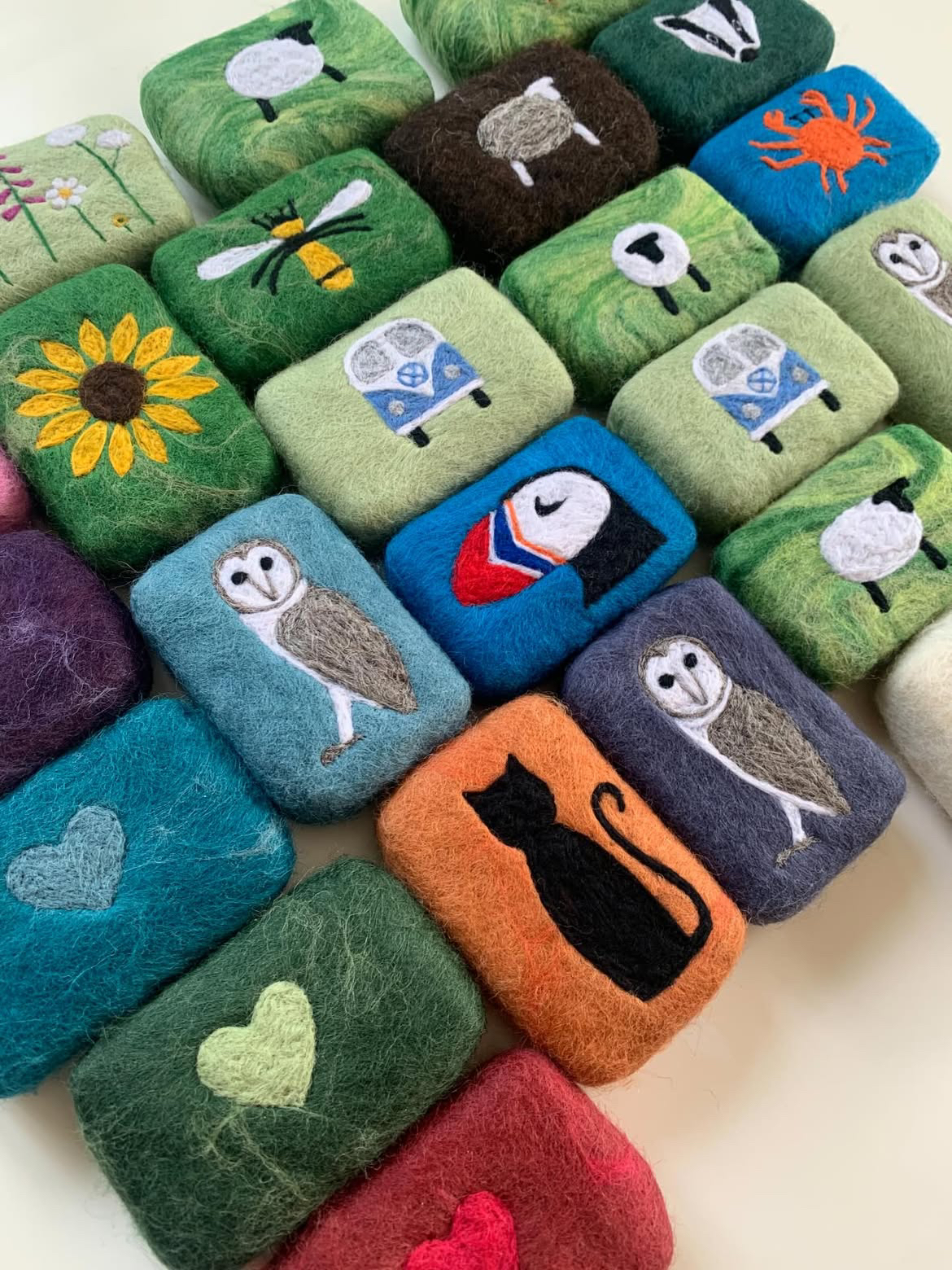 Bars of soap wrapped in needle felted cotton for an exfoliating wash