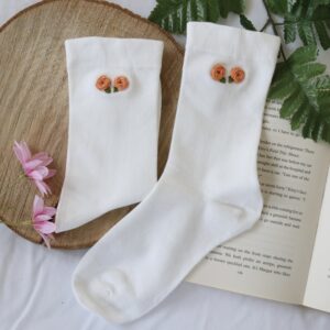 White cotton socks hand embroidered with pink roses
