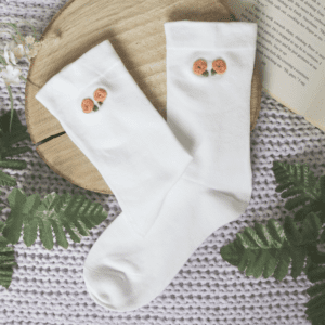 Hand embroidered roses on white cotton socks