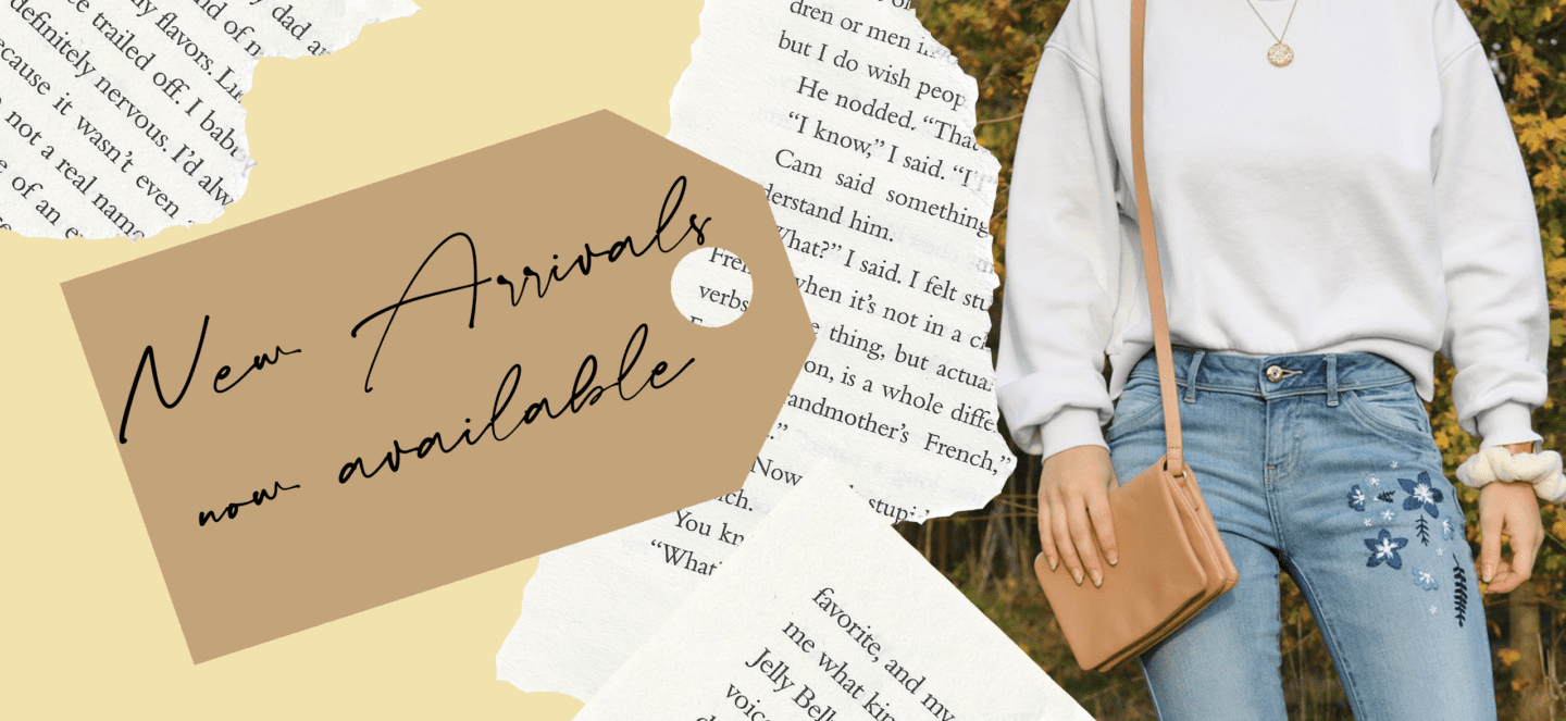 A woman wearing blue jeans hand embroidered with blue flowers paired with a white sweatshirt and a tag reading 'new arrivals now available'